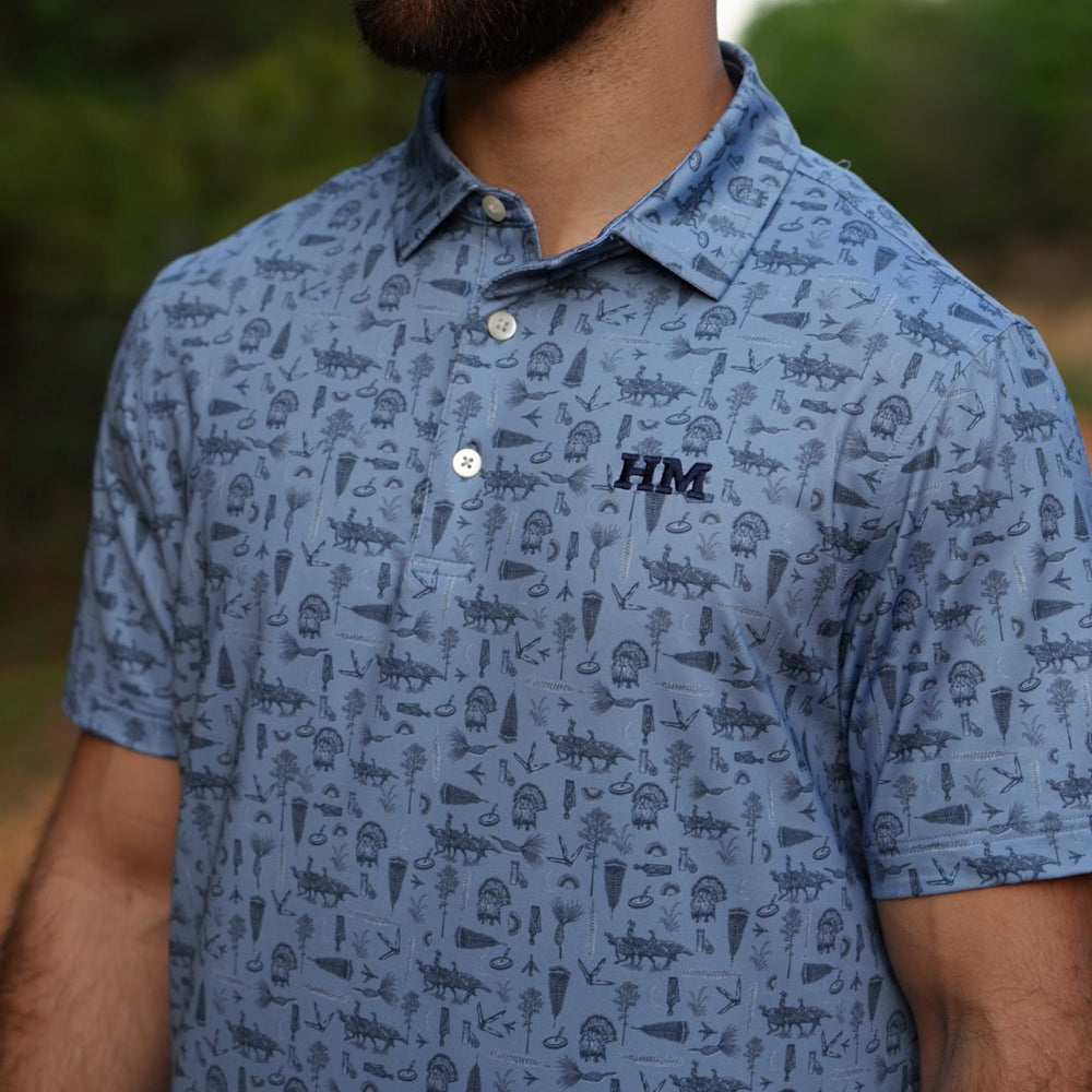 
                  
                    Tom of All Trades Performance Polo
                  
                