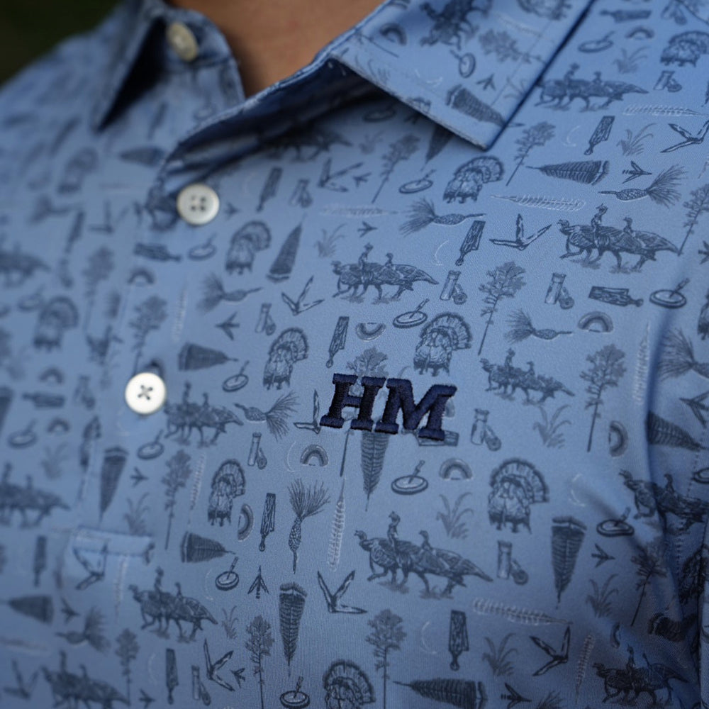 
                  
                    Tom of All Trades Performance Polo
                  
                