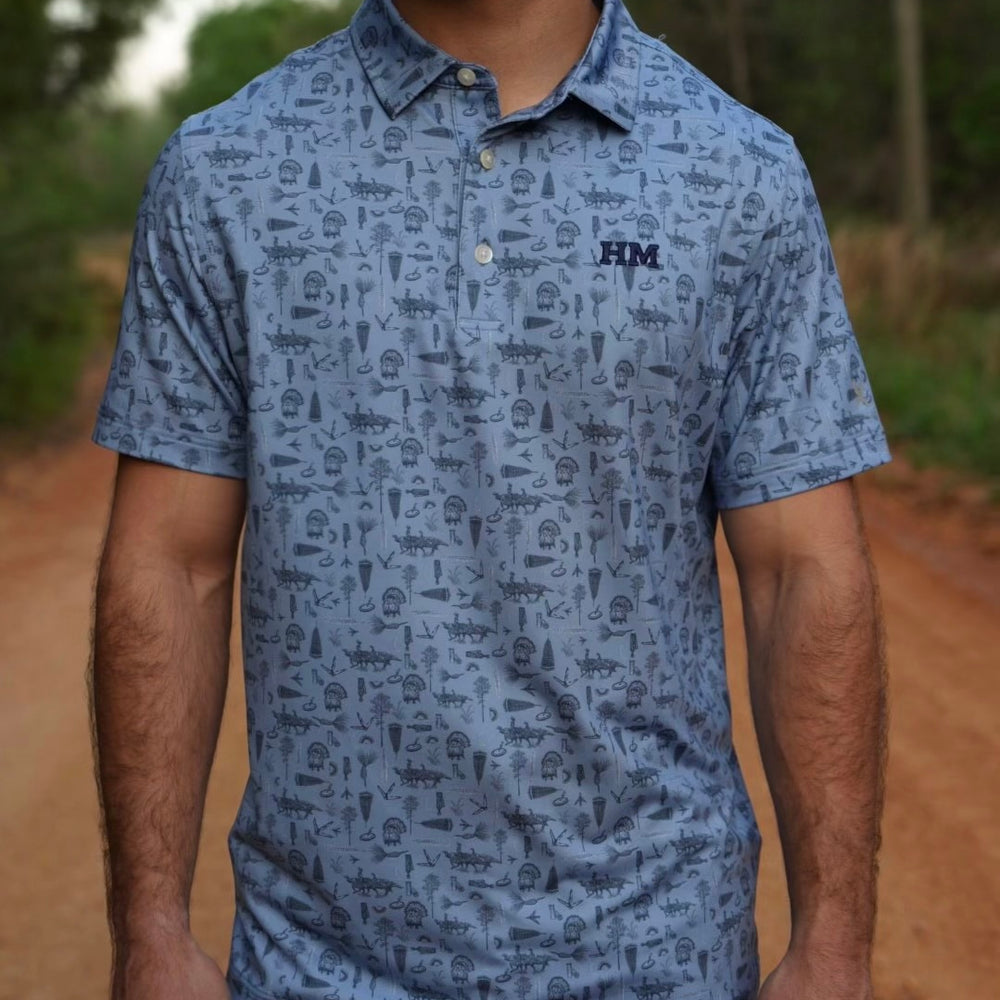 
                  
                    Tom of All Trades Performance Polo
                  
                