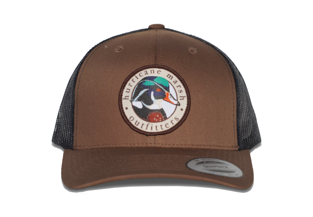 
                  
                    The Woodie Cayote Brown/Black Hat
                  
                